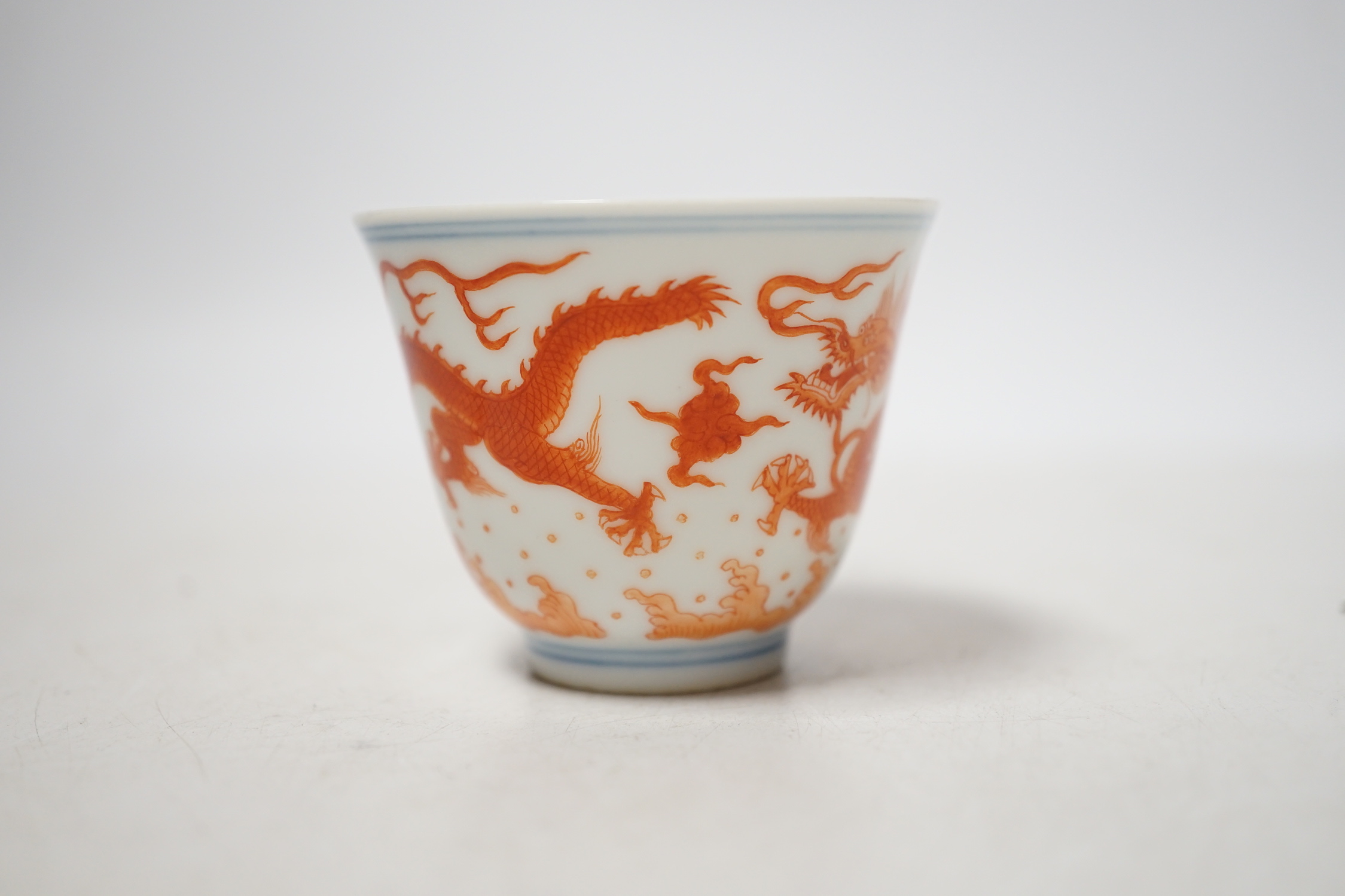 A Chinese iron red enamelled ‘dragon’ tea bowl, 5cm high